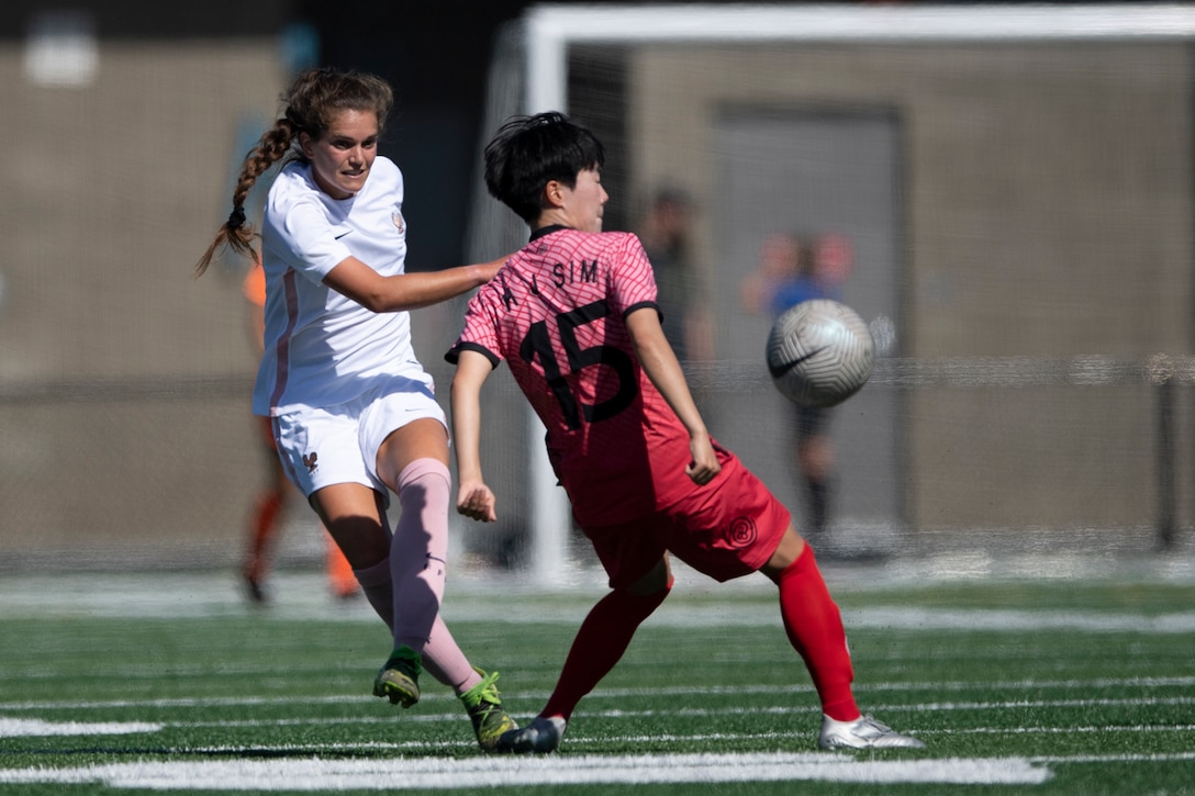 France's Rachel Corboz, left, battles South Korean midfielder Hyo Jeong Sim during  France's 1-0 victory July 20, 2022. Corboz, who has dual American and French citizenship, scored in the winning goal in the 90th minute to send France to the gold medal match of the 2022 World Military Women's Football Championship in Spokane, Wash.