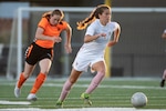 French center midfielder Rachel Corboz, right, pushes the ball upfield during France's 8-0 victory over the Netherlands in the 2022 World Military Women's Football Championship on July 12, 2022.