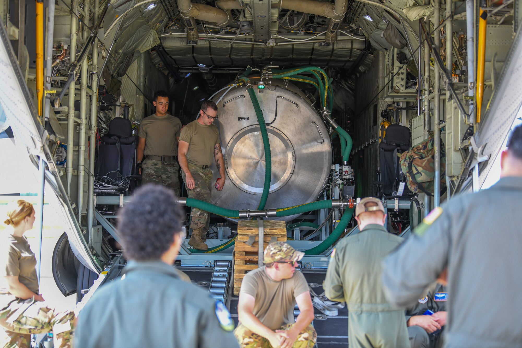 Crew members prepapre a C-130H Hercules aircraft and installed prototype modular aerial spray system for its first test flight at Youngstown Air Reserve Station, Ohio, July 25, 2022.