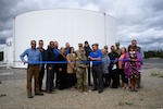 Attendees of the North Pole Defense Fuel Support Point ribbon-cutting ceremony pose for a group photo