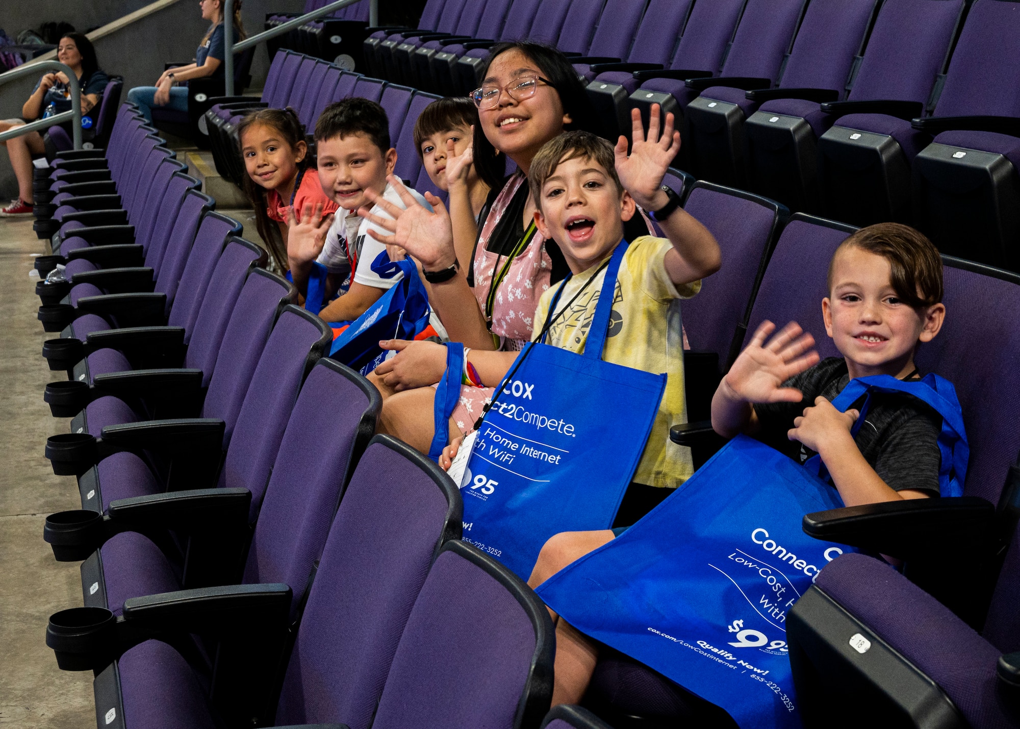 Children from both civilian and military families wait for school supplies at the Back to School Bash event July 20, 2022, at Grand Canyon University, Phoenix, Arizona.