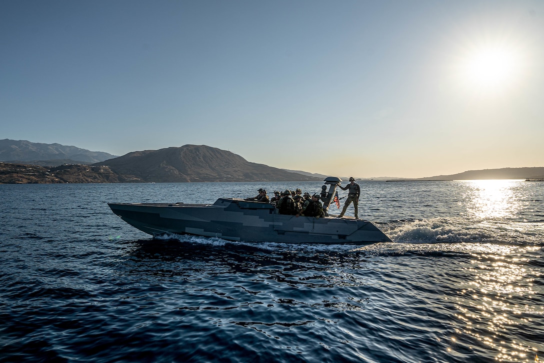 U.S. Naval Special Warfare Combatant-Craft Crewmen with Special Boat Team. TWELVE, U.S. Naval Special Warfare Group FOUR operate a combat craft assault while carrying Swedish Marines with 4th Marine Regiment, Swedish Amphibious Corps during exercise TYR 22 at the NATO Maritime Interdiction Operational Training Centre in Souda bay, Greece, July 21, 2022. TYR 22 is a maritime interdiction operations exercise held at NMIOTC, bringing together Swedish Marines, U.S. Marines, U.S. Navy Special warfare combatant-craft crewmen to improve US and NATO Partner operational capacity, capability, and interoperability.