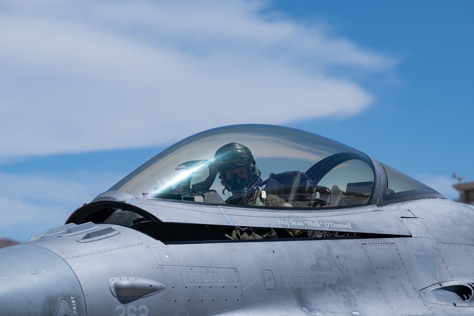 Lt. Col. Kevin "Mongo" Jens, pilot assigned to the 59th Test and Evaluation Squadron, 53d Wing, Eglin Air Force Base, Florida, completes four thousand flight hours as an F-16 pilot at Nellis Air Force Base, Nevada, July 8, 2022. Jens started in A-10s and flew in Desert Storm as a Lt.  and flew his first F-16 in 1997. (U.S. Air Force photo by Airman 1st Class Josey Blades)