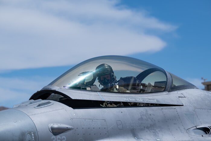 Lt. Col. Kevin "Mongo" Jens, pilot assigned to the 59th Test and Evaluation Squadron, 53d Wing, Eglin Air Force Base, Florida, completes four thousand flight hours as an F-16 pilot at Nellis Air Force Base, Nevada, July 8, 2022. Jens started in A-10s and flew in Desert Storm as a Lt.  and flew his first F-16 in 1997. (U.S. Air Force photo by Airman 1st Class Josey Blades)