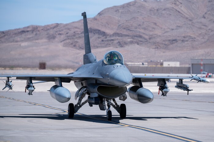 Lt. Col. Kevin "Mongo" Jens, pilot assigned to the 59th Test and Evaluation Squadron, 53d Wing, Eglin Air Force Base, Florida, completes over four thousand flight hours as an F-16 pilot at Nellis Air Force Base, Nevada, July 8, 2022. This is a feat few pilots have been able to accomplish in the Air Force's 75-year history. Jens started in A-10s and flew in Desert Storm as a Lt.  and flew his first F-16 in 1997.(U.S. Air Force photo by Airman 1st Class Josey Blades)