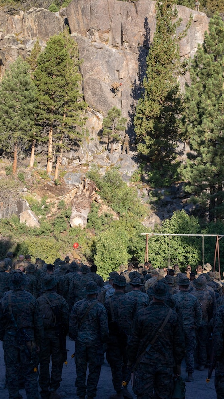 U.S. Marines with H&S Company, 1st Battalion, 24th Marine Regiment, 4th Marine Division, Marine Forces Reserve, are shown by instructors on how to rappel down a cliff during a training class at Marine Corps Mountain Warfare Training Center, Bridgeport, Calif., July 22, 2022, for Mountain Training Exercise 4-22. MTX 4-22 prepares Marines for the challenges of operating in a harsh, mountainous environment many of their adversaries are acclimated to. (U.S. Marine Corps photo by Cpl. Jonathan L. Gonzalez)