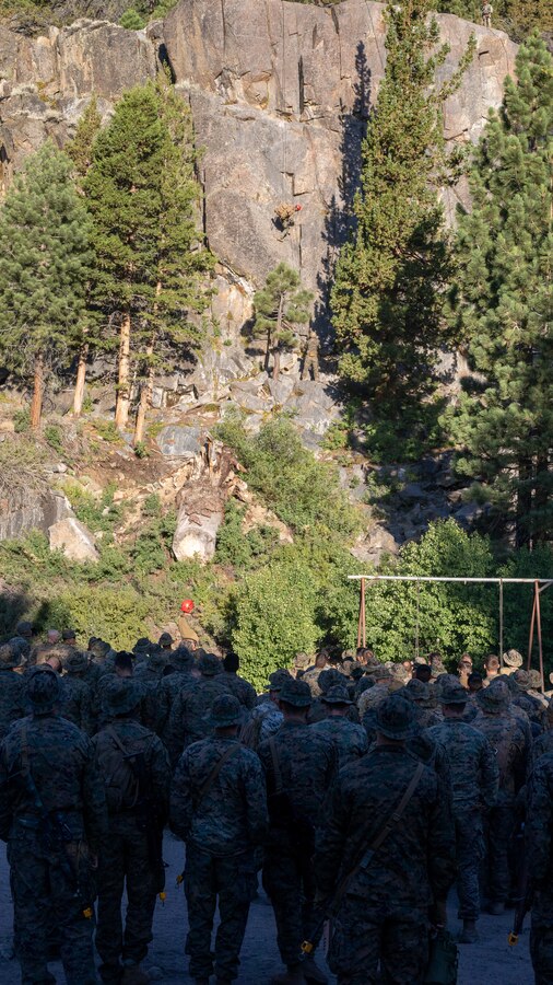 U.S. Marines with H&S Company, 1st Battalion, 24th Marine Regiment, 4th Marine Division, Marine Forces Reserve, are shown by instructors on how to rappel down a cliff during a training class at Marine Corps Mountain Warfare Training Center, Bridgeport, Calif., July 22, 2022, for Mountain Training Exercise 4-22. MTX 4-22 prepares Marines for the challenges of operating in a harsh, mountainous environment many of their adversaries are acclimated to. (U.S. Marine Corps photo by Cpl. Jonathan L. Gonzalez)