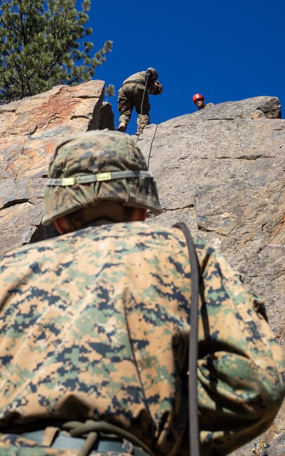 U.S. Marines with H&S Company, 1st Battalion, 24th Marine Regiment, 4th Marine Division, Marine Forces Reserve, rappel down a cliff during a training event at Marine Corps Mountain Warfare Training Center, Bridgeport, Calif., July 22, 2022, for Mountain Training Exercise 4-22. MTX 4-22 offers a unique training experience for reserve Marines to prepare and develop an understanding of traversing a mountainous environment as they maintain their readiness. (U.S. Marine Corps photo by Cpl. Jonathan L. Gonzalez)