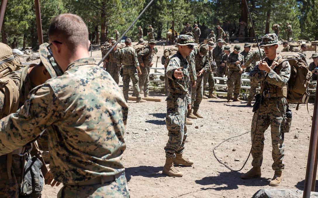 U.S. Marines with H&S Company, 1st Battalion, 24th Marine Regiment, 4th Marine Division, Marine Forces Reserve, practice rope rappelling after a training class at Marine Corps Mountain Warfare Training Center, Bridgeport, Calif., July 22, 2022, for Mountain Training Exercise 4-22. MTX 4-22 allowed reserve Marines to participate in mountain warfare operations for realistic combat training in order to facilitate increased readiness for the Marine Forces Reserve. (U.S. Marine Corps photo by Cpl. Jonathan L. Gonzalez)
