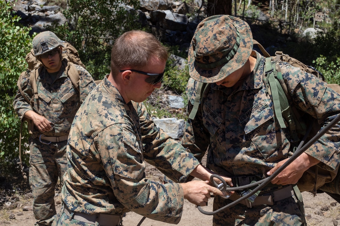 U.S. Marines with H&S Company, 1st Battalion, 24th Marine Regiment, 4th Marine Division, Marine Forces Reserve, rappel down a cliff during a training evolution at Marine Corps Mountain Warfare Training Center, Bridgeport, Calif., July 22, 2022, for Mountain Training Exercise 4-22. MTX 4-22 allowed reserve Marines to participate in mountain warfare operations for realistic combat training in order to facilitate increased readiness for the Marine Forces Reserve. (U.S. Marine Corps photo by Cpl. Jonathan L. Gonzalez)