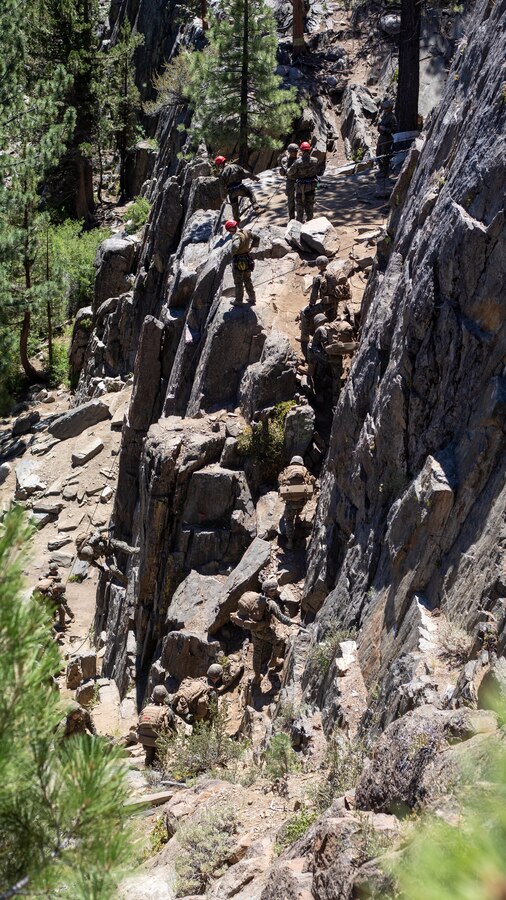 U.S. Marines with H&S Company, 1st Battalion, 24th Marine Regiment, 4th Marine Division, Marine Forces Reserve, rappel down a cliff during a training evolution at Marine Corps Mountain Warfare Training Center, Bridgeport, Calif., July 22, 2022, for Mountain Training Exercise 4-22. MTX 4-22 prepares Marines for the challenges of operating in a harsh, mountainous environment many of their adversaries are acclimated to. (U.S. Marine Corps photo by Cpl. Jonathan L. Gonzalez)