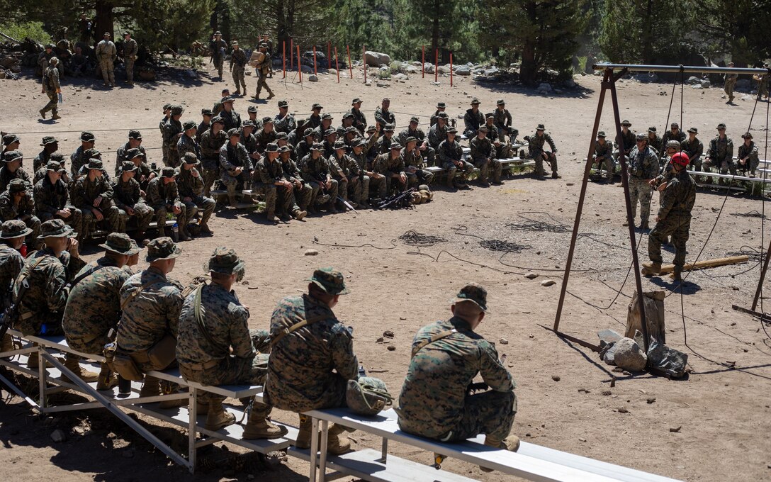 U.S. Marines with H&S Company, 1st Battalion, 24th Marine Regiment, 4th Marine Division, Marine Forces Reserve, are taught by instructors on rappelling down a cliff during a training class at Marine Corps Mountain Warfare Training Center, Bridgeport, Calif., July 22, 2022, for Mountain Training Exercise 4-22. MTX 4-22 allowed reserve Marines to participate in mountain warfare operations for realistic combat training in order to facilitate increased readiness for the Marine Forces Reserve. (U.S. Marine Corps photo by Cpl. Jonathan L. Gonzalez)