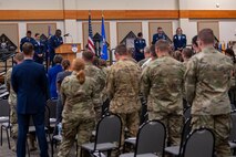 Capt. Dominic Smyth, 341st Missile Wing chaplain, leads Malmstrom personnel in prayer during a change of command ceremony July 28, 2022, at Malmstrom Air Force Base, Mont. Lt. Col. Darren Damiani relinquished command of the 341st Medical Operational Readiness Squadron to Lt. Col. Jennifer Harward. (U.S. Air Force photo by Airman 1st Class Elijah Van Zandt)
