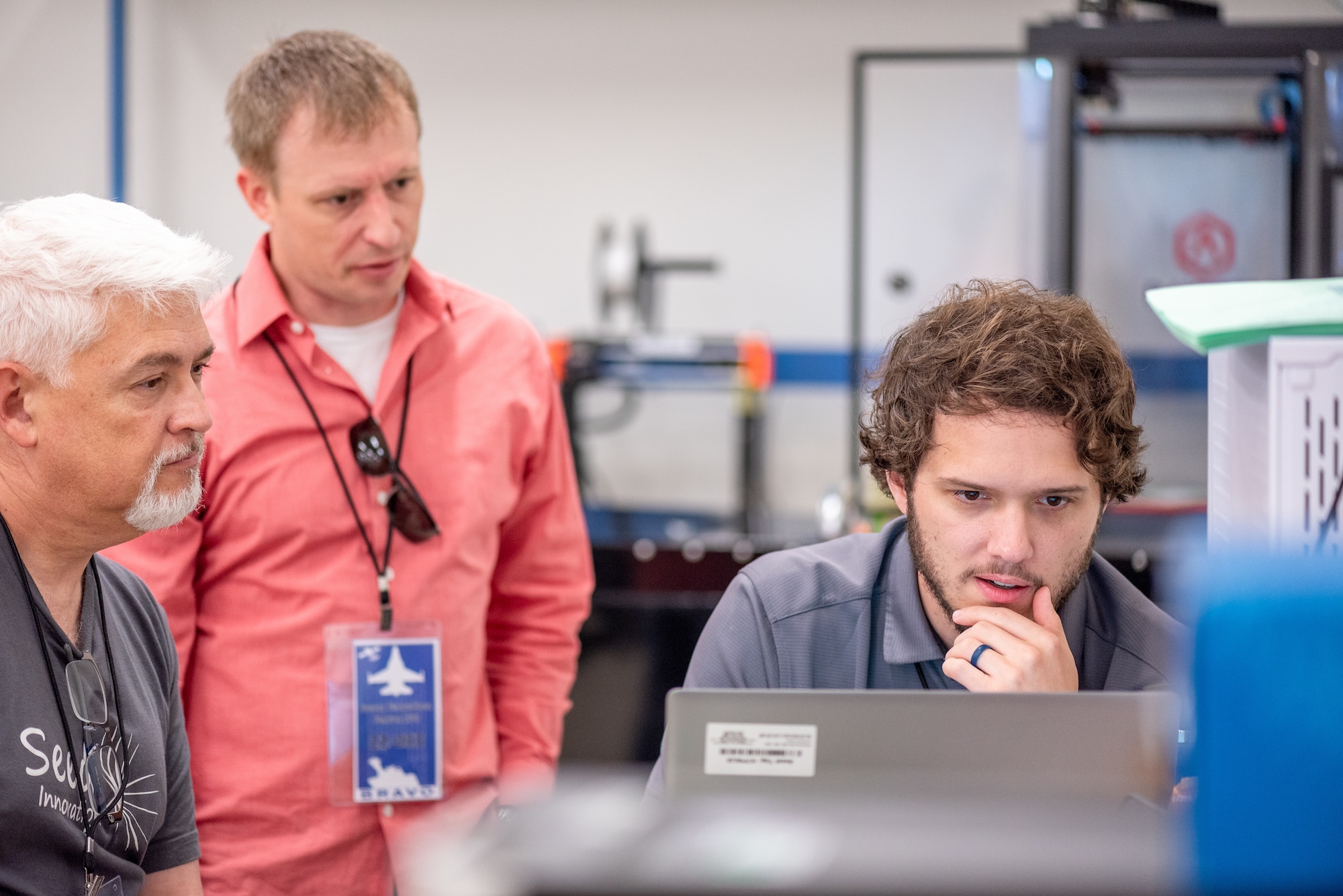 Participants of the BRAVO Hackathon review data July 18, 2022, at Patrick Space Force Base, Fla. The event brought engineers, scientists, and coders together from four countries to solve problems with the launch mission. (U.S. Space Force photo by Amanda Inman)