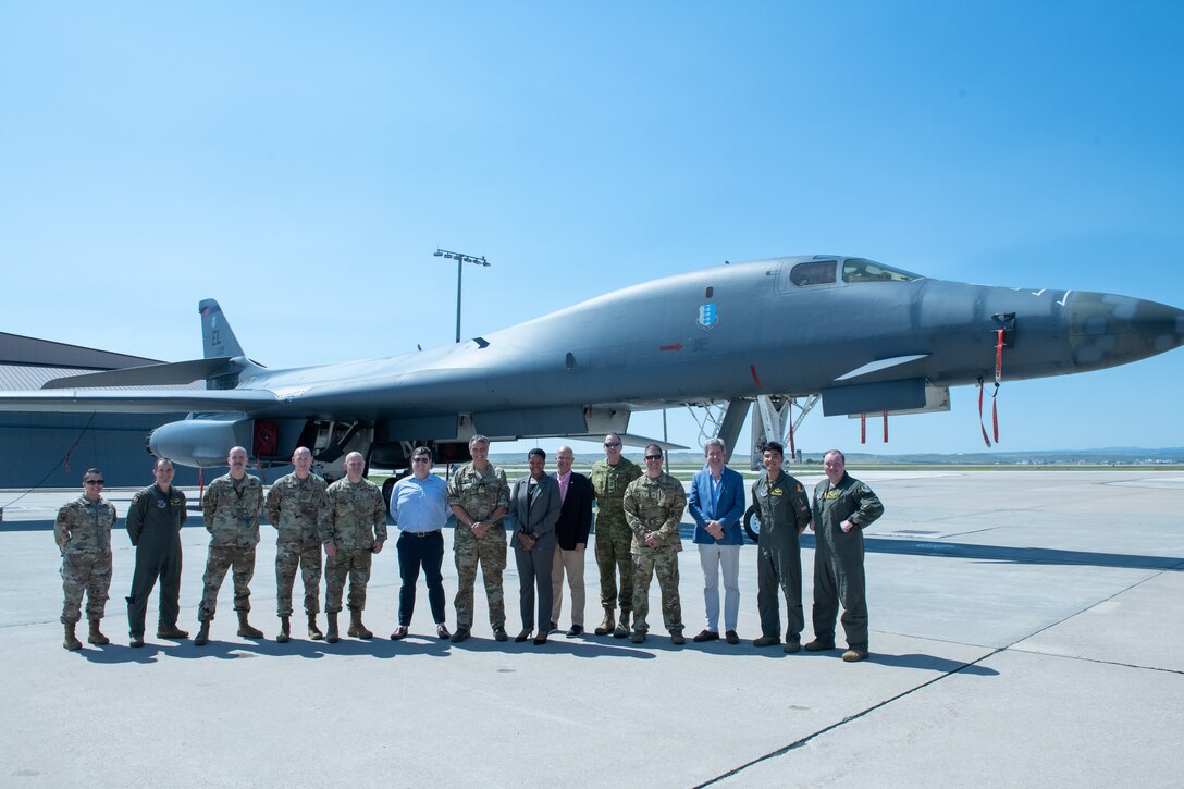 Visiting foreign defense attaches pose for a group photo with 28th Bomb Wing leadership and personnel at Ellsworth Air Force Base, S.D., July 20, 2022.