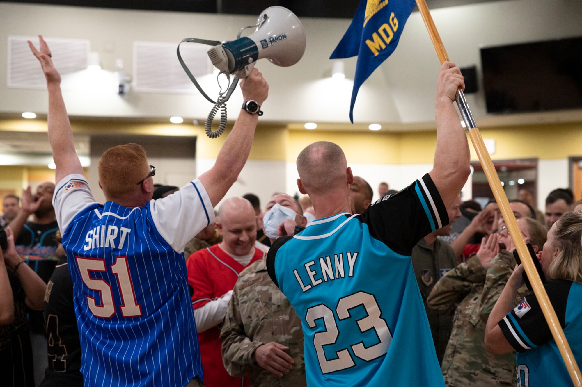 Airmen from the 51st Medical Group cheer during the 51st Fighter Wing second quarter awards ceremony