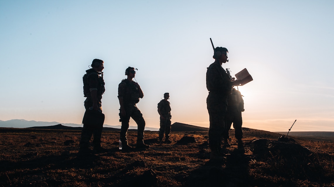 U.S. Marines with 3d Marine Littoral Regiment, 3d Marine Division, and U.S. Airmen with 40th Helicopter Squadron from Malmstrom Air Force Base Great Falls, Montana, control aviation fires during Exercise Garnet Rattler at Gowen Field Air National Guard Base, Idaho, May 4, 2022.