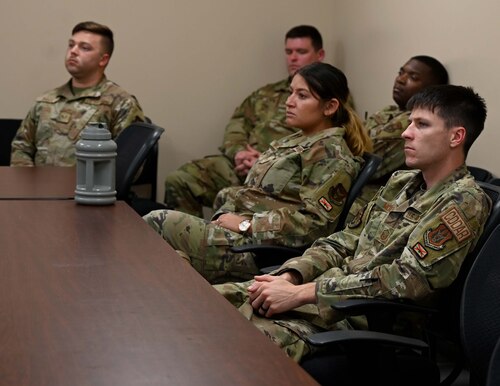members listen to a briefing