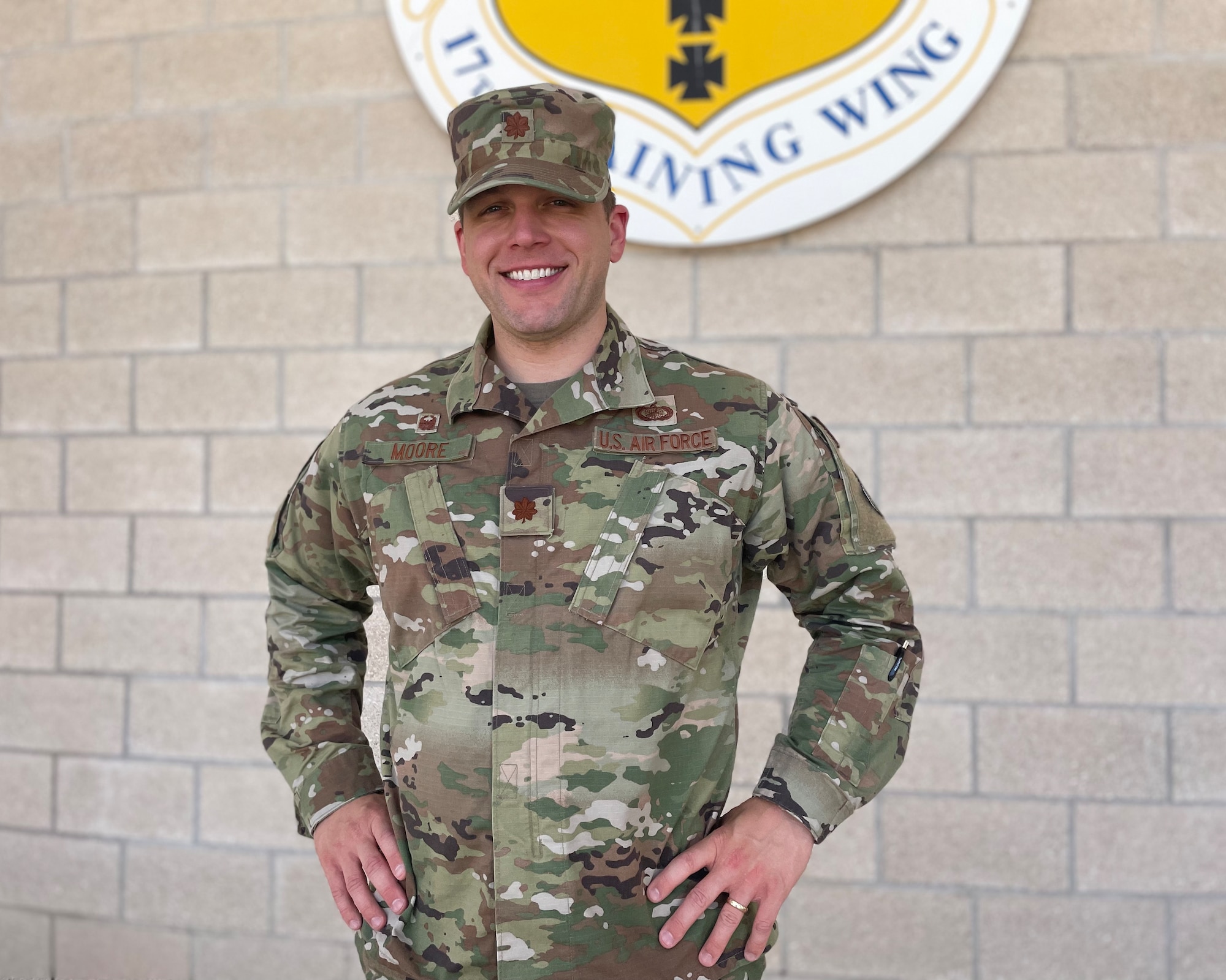 U.S. Air Force Maj. Justin Moore, 17th Comptroller Squadron and 17th Wing Staff Agencies commander, poses outside of the Norma Brown building, Goodfellow Air Force Base, Texas, June 24, 2022. Moore earned his commission in 2010 and obtained a Ph.D. in economics from George Mason University. (U.S. Air Force photo by Senior Airman Abbey Rieves)