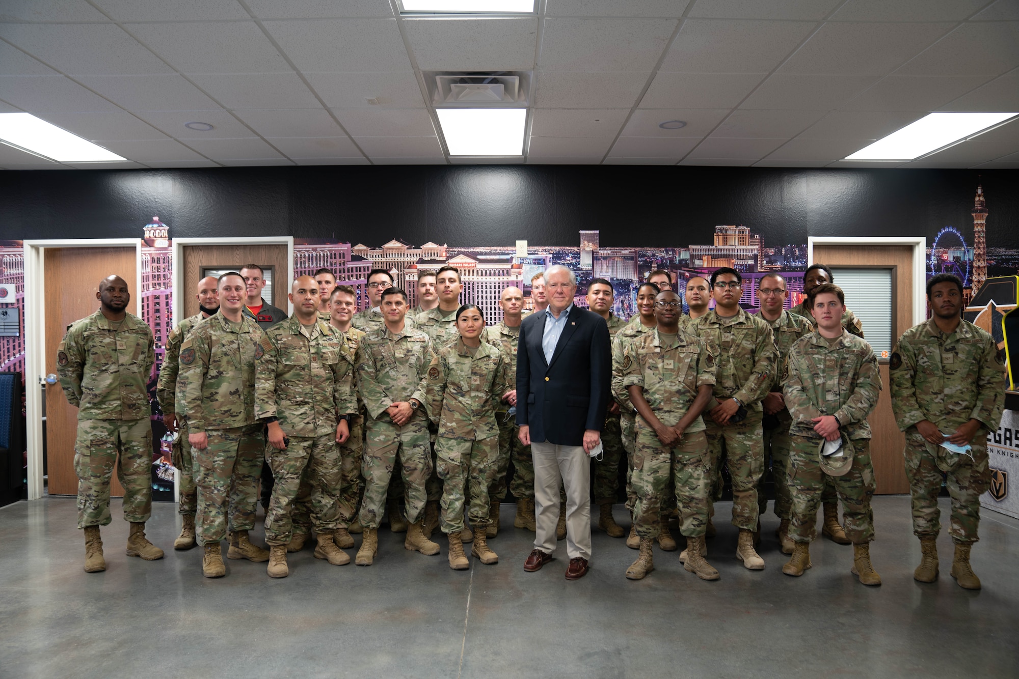 Secretary of the Air Force Frank Kendall poses with Airmen assigned to the 432nd Wing/432nd Expeditionary Wing at Creech Air Force Base, Nevada, July 29, 2022. Kendall participated in a roundtable discussion to listen and respond to their questions and concerns. (U.S. Air Force photo by Airman 1st Class Ariel O'Shea)