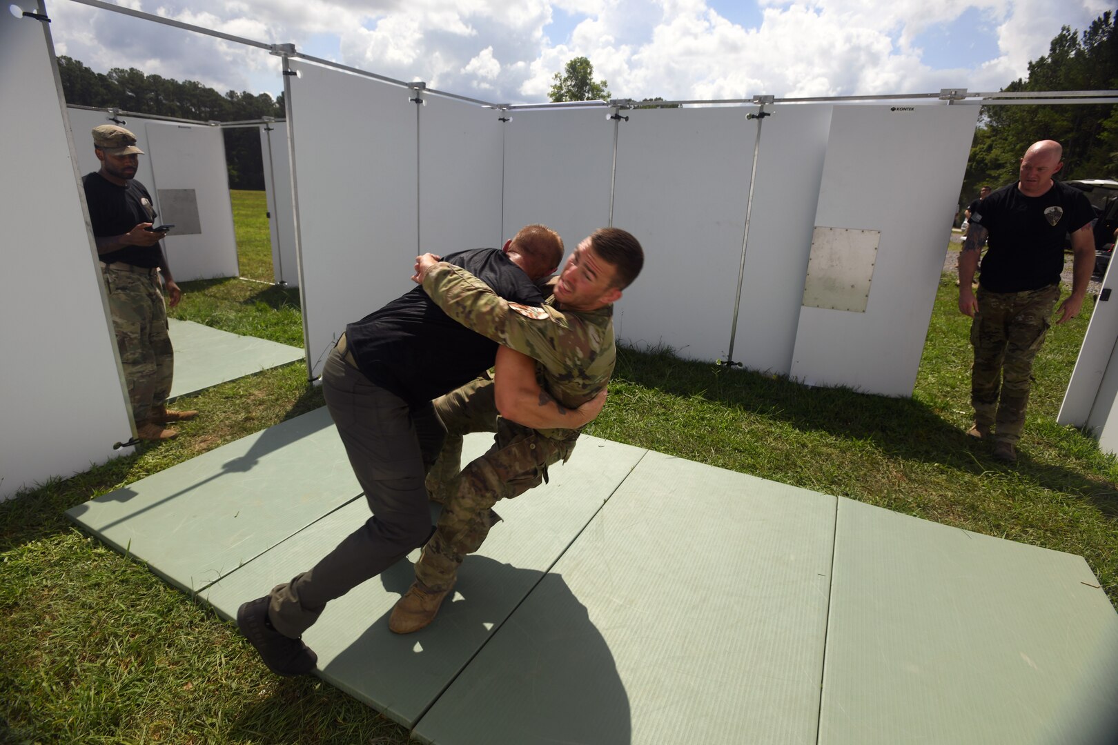 Army Sgt. Richard Carlson, a combat medic with the Minnesota Army National Guard’s Headquarters and Headquarters Troop, 1st Battalion, 94th Cavalry Regiment, brings down an opponent as part of the Valor Run event during the 2022 Army National Guard Best Warrior Competition, Volunteer Training Site-Tullahoma, Tennessee, July 28.