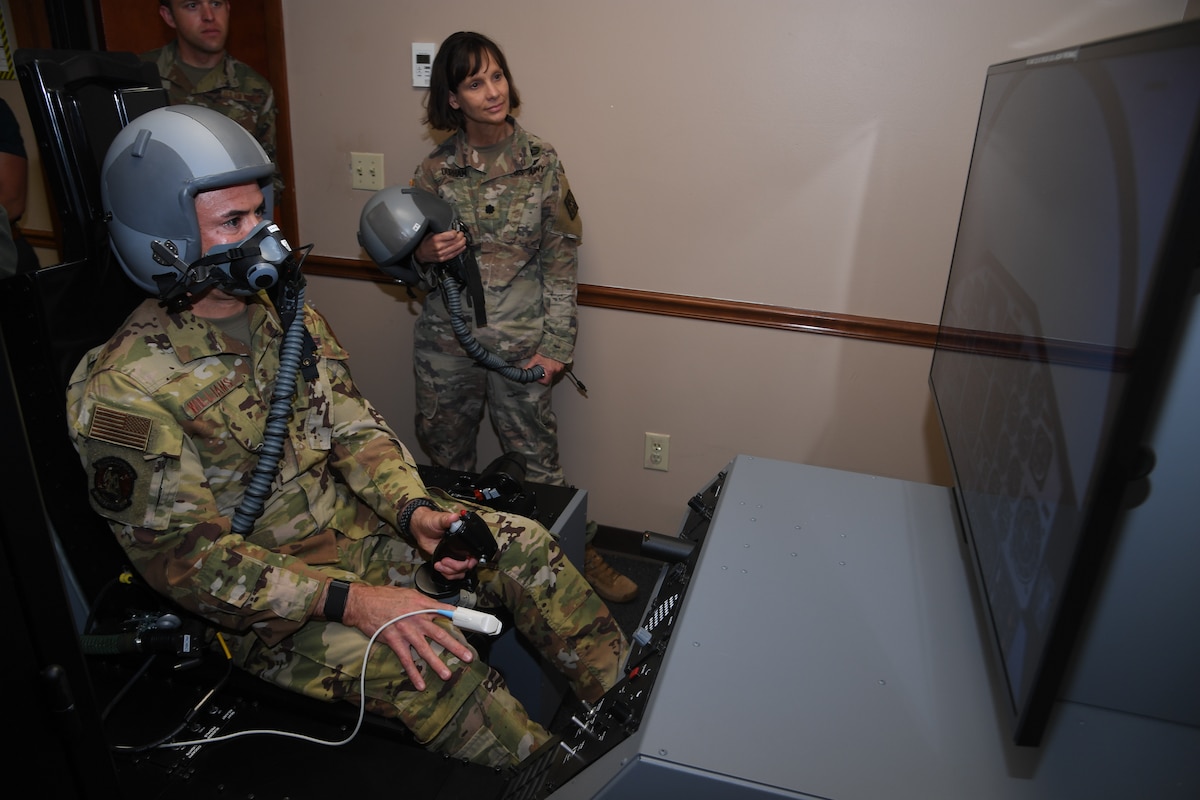 Maj. Owen John Williams flies a simulator that introduces hypoxia like symptoms to orient users on its effects and learn how to recover