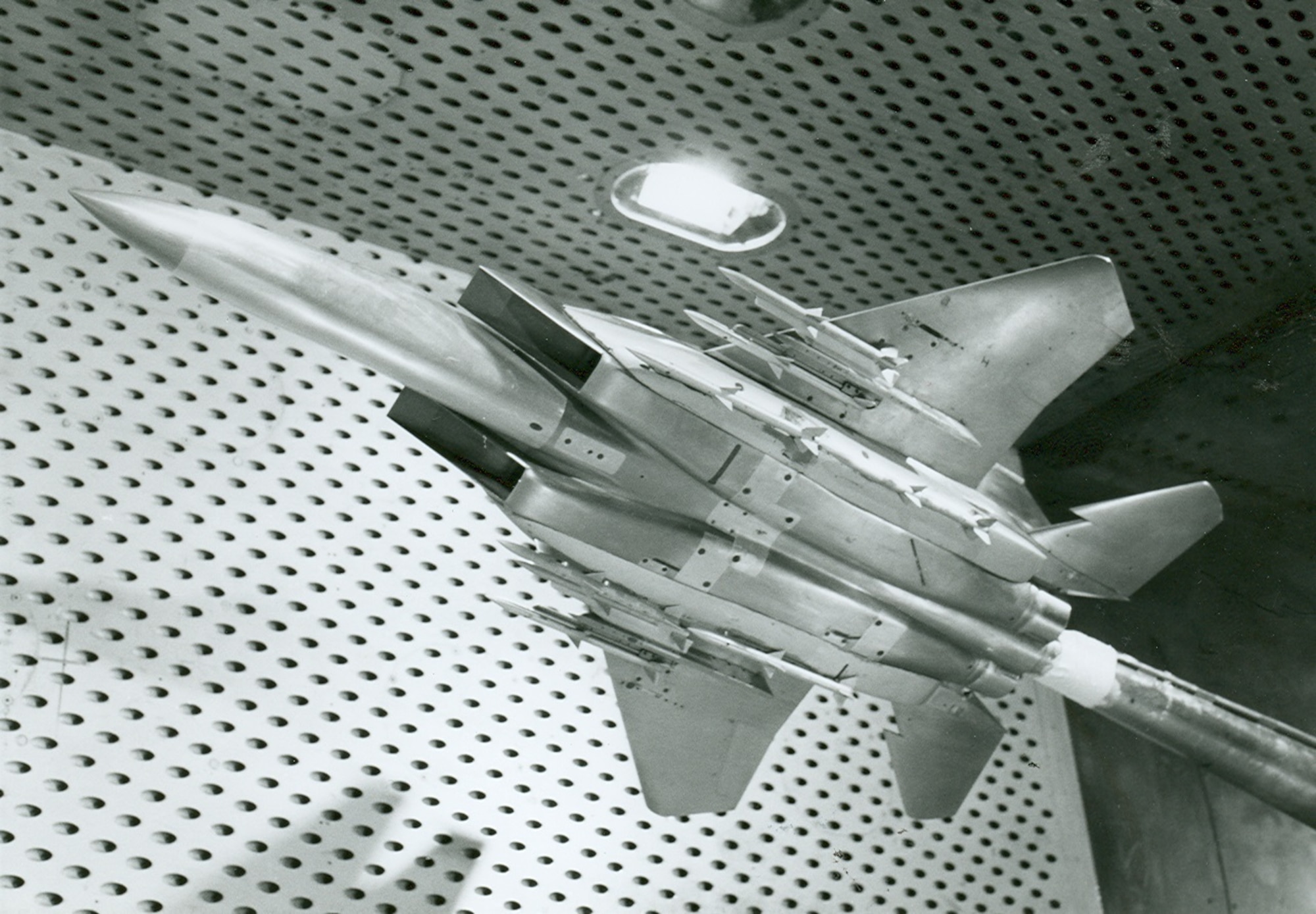 A scale model of the F-15 Eagle undergoes testing in the early 1980s in the 4-foot transonic wind tunnel at Arnold Air Force Base, Tennessee, headquarters of Arnold Engineering Development Complex. The Air Force recently celebrated the 50th anniversary of the F-15’s deployment. Models of the aircraft, engines and other F-15 components have frequently been tested by AEDC over the past 50 years. (U.S. Air Force photo)