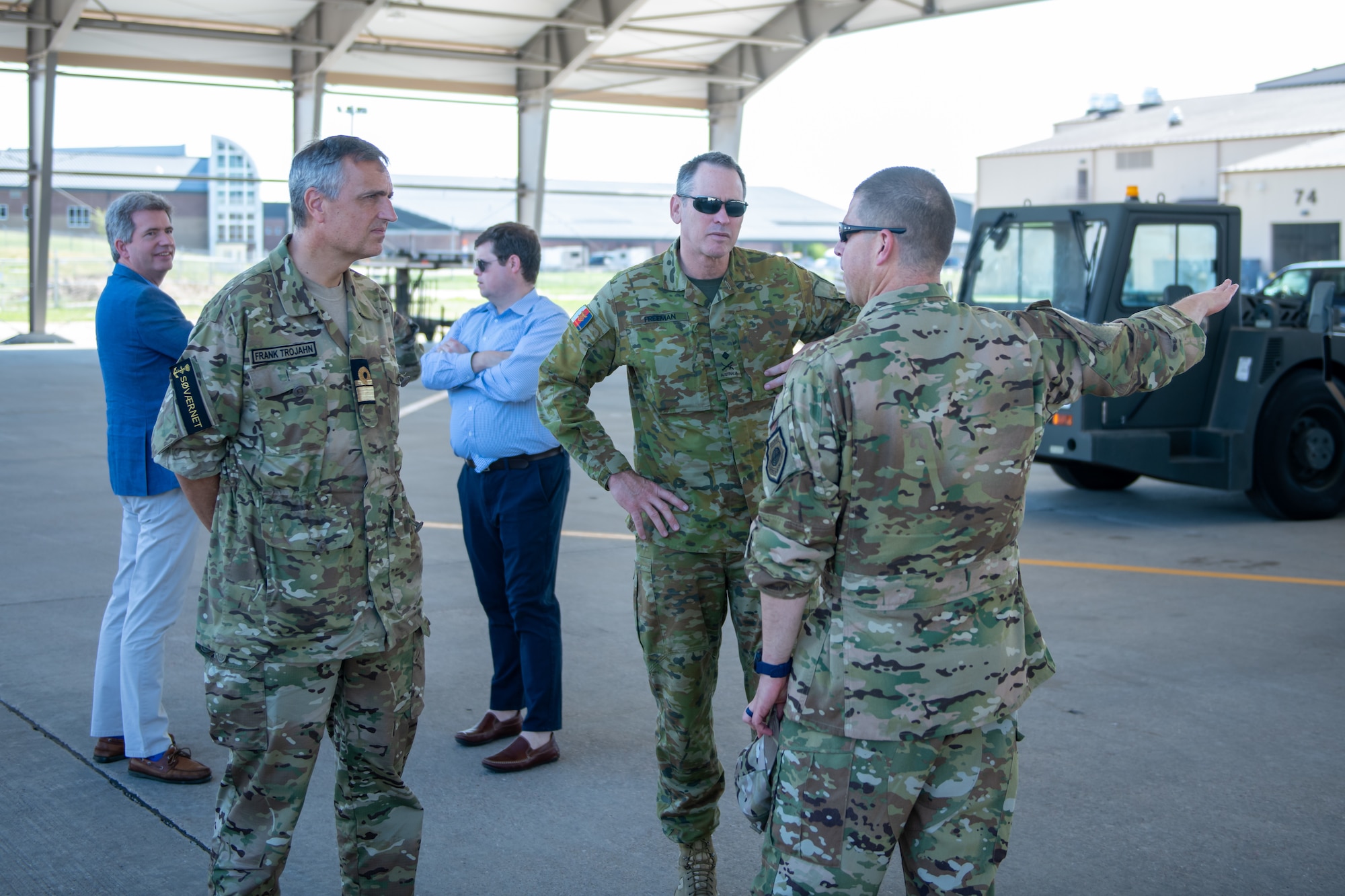 U.S. Air Force Col. Seth Spanier, 28th Bomb Wing vice commander, guides foreign defense attaches on the flight line at Ellsworth Air Force Base, S.D., July 20, 2022.