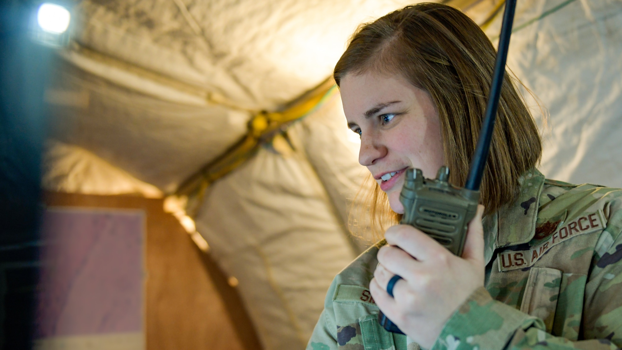 U.S. Air Force Alexandria Smith, a grounds transportation operations center dispatcher with the 378th Expeditionary Logistics Readiness Squadron, talks on a radio at Prince Sultan Air Base, Kingdom of Saudi Arabia, July 21, 2022