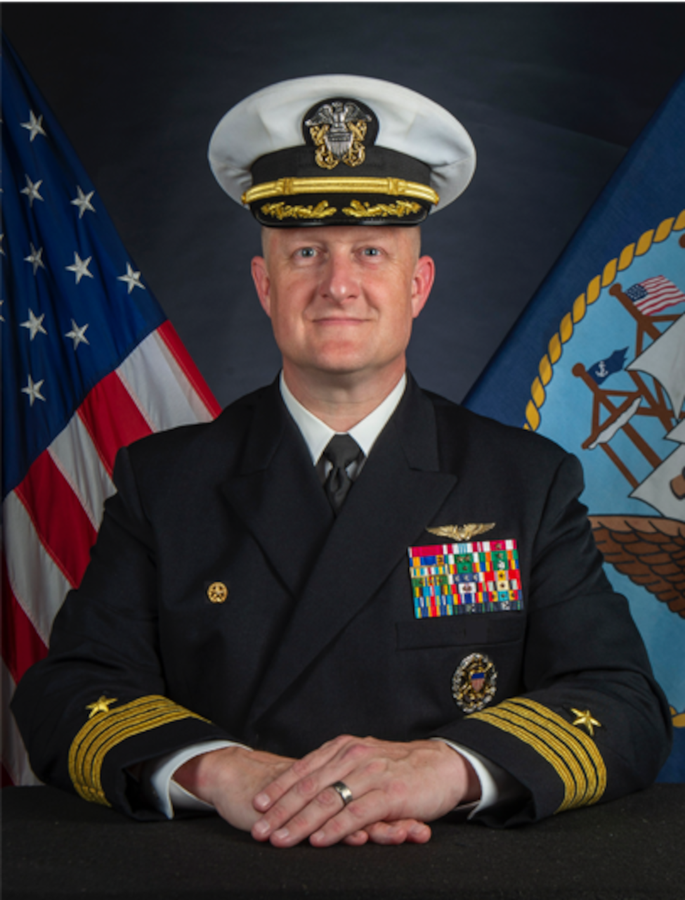 Official studio portrait of Capt. Richard Burgess, Commanding Officer, USS Lewis B. Puller (ESB 3)