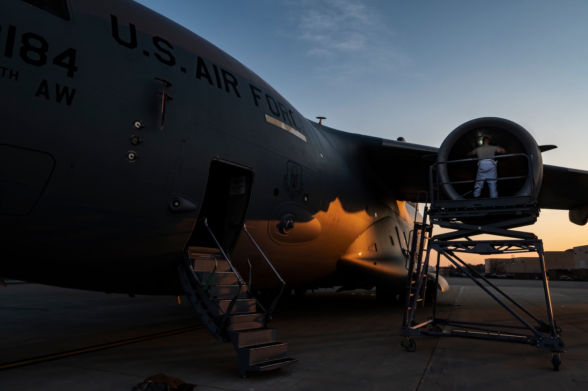 Tech. Sgt. Samuel Peoples, 911th Maintenance Squadron aerospace propulsion technician, inspects an engine on a C-17 Globemaster III while preparing for an eco-wash at the Pittsburgh International Airport Air Reserve Station, Pennsylvania, March 18, 2022