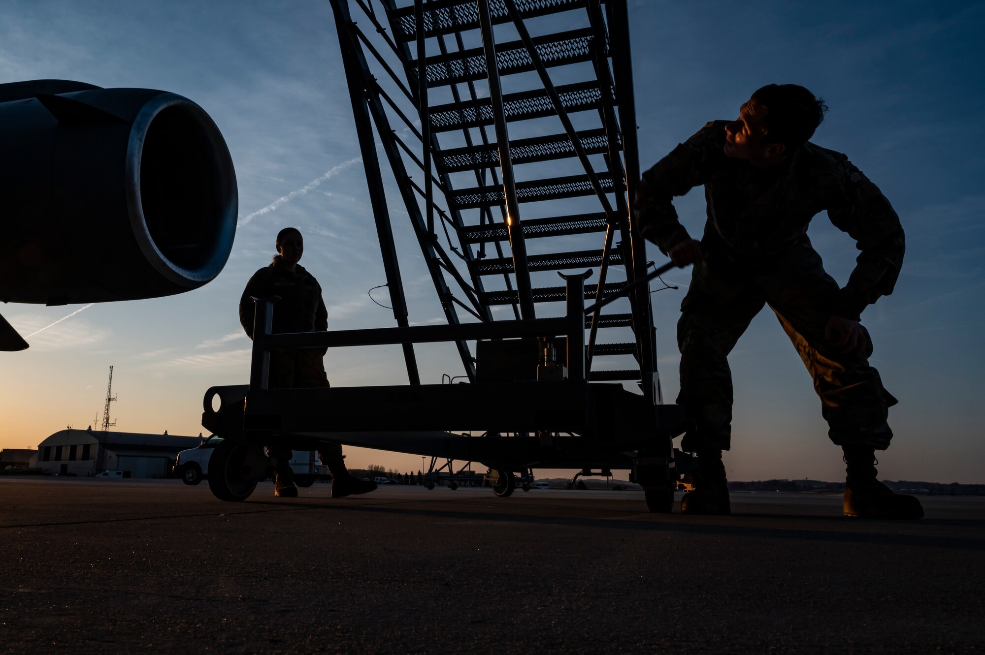 Airman 1st Class Liam Pritchard, 911th Maintenance Squadron aerospace propulsion technician, raises a maintenance stand while preparing for an eco-wash to be conducted on a C-17 Globemaster III's engines at the Pittsburgh International Airport Air Reserve Station, Pennsylvania, March 18, 2022.