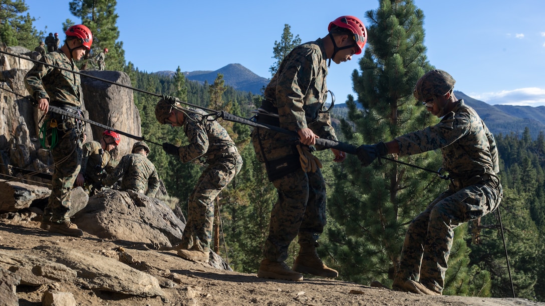 U.S. Marines with H&S Company, 1st Battalion, 24th Marine Regiment, 4th Marine Division, Marine Forces Reserve, rappel down a cliff during a training event at Marine Corps Mountain Warfare Training Center, Bridgeport, Ca., July 22, 2022, for Mountain Training Exercise 4-22. MTX 4-22 allowed reserve Marines to participate in mountain warfare operations for realistic combat training in order to facilitate increased readiness for the Marine Forces Reserve.