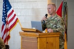 U.S. Army Capt. Max Woodfin, commander, Company D, 572nd Brigade Engineer Battalion, 86th Infantry Brigade Combat Team (Military Intelligence) speaks at a return ceremony for his unit March 10, 2022, in Denver, Colorado. While deployed, the unit joined with NATO's peace support operation Kosovo Force.  KFOR has been operating in the Southeast European country since 1999, with intent to support broader international efforts to build peace and stability in the region. (U.S. Army National Guard photo by Capt. Remington Henderson).