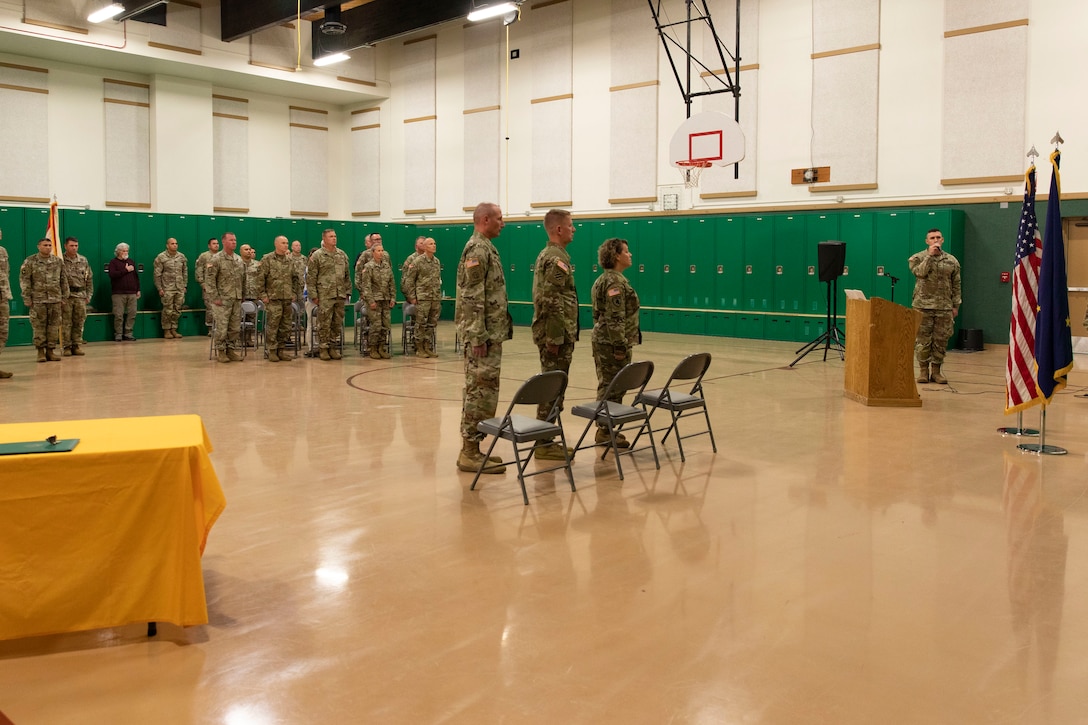 Alaska Army Guard Sgt. Seth LaCount sings the National Anthem and state song during a change of responsibility ceremony at the Alcantra Armory in Wasilla, Alaska, Aug. 1, 2022. Command Sgt. Maj. Julie Small relinquished responsibility as the 297th Regional Support Group's Senior Enlisted Leader to Command Sgt. Maj. Ryan Weimer. (Alaska National Guard photo by Victoria Granado)