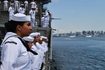 Sailors man the rails aboard the Ticonderoga-class guided-missile cruiser USS Lake Champlain (CG 57) during a parade of ships in support of Seattle Fleet Week 2022.