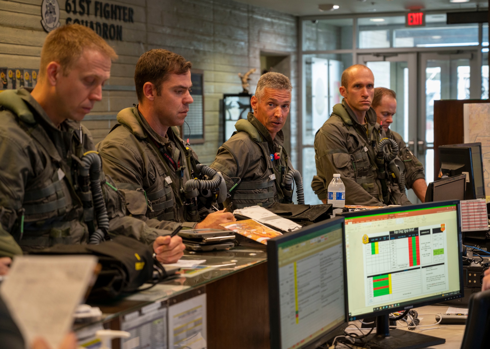 U.S. Air Force Brig. Gen. Gregory Kreuder, 56th Fighter Wing commander, attends the pre-flight brief for his “fini” flight with Lt. Col. Michael Powell, 56th Operational Group deputy commander, Capt. Jacob Brodacz, 61st Fighter Wing instructor pilot, and Capt. Ryan McCooey, 61st FS instructor pilot July 25, 2022, at Luke Air Force Base, Arizona.