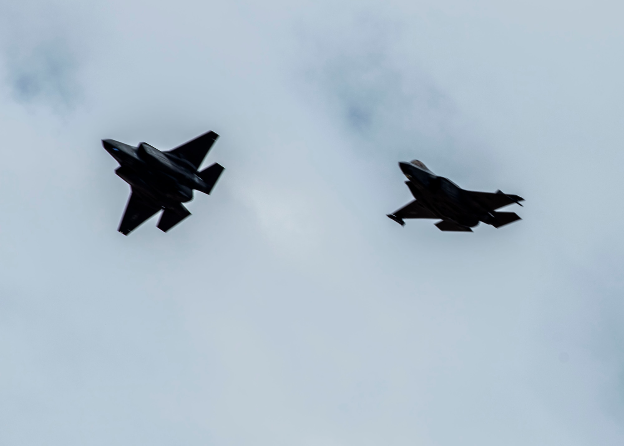 Two F-35A Lightning II aircraft soar in formation July 25, 2022, at Luke Air Force Base, Arizona.