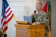 U.S. Army Capt. Max Woodfin, commander, Company D, 572nd Brigade Engineer Battalion, 86th Infantry Brigade Combat Team (Military Intelligence) speaks at a return ceremony for his unit March 10, 2022, in Denver, Colorado. While deployed, the unit joined with NATO's peace support operation Kosovo Force.  KFOR has been operating in the Southeast European country since 1999, with intent to support broader international efforts to build peace and stability in the region. (U.S. Army National Guard photo by Capt. Remington Henderson).