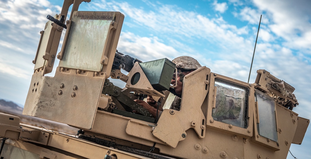 U.S. Marine Corps Cpl. Alex Maciel, a motor transport operator with Marine Wing Support Squadron 473, 4th Marine Aircraft Wing, Marine Forces Reserve, sets security with a M240 medium machine gun on Range 205A during Integrated Training Exercise 4-22 at Marine Corps Air-Ground Combat Center, Twentynine Palms, Calif., July 29, 2022. The mobile operations course challenges supporting elements of the Marine Air-Ground Task Force to respond to contact while delivering logistical supplies to other elements of the MAGTF. ITX is designed to provide large forces the opportunity to command and control their Marines through a live-fire program incorporating every element of the MAGTF. (U.S. Marine Corps photo by Sgt. Matthew Teutsch)