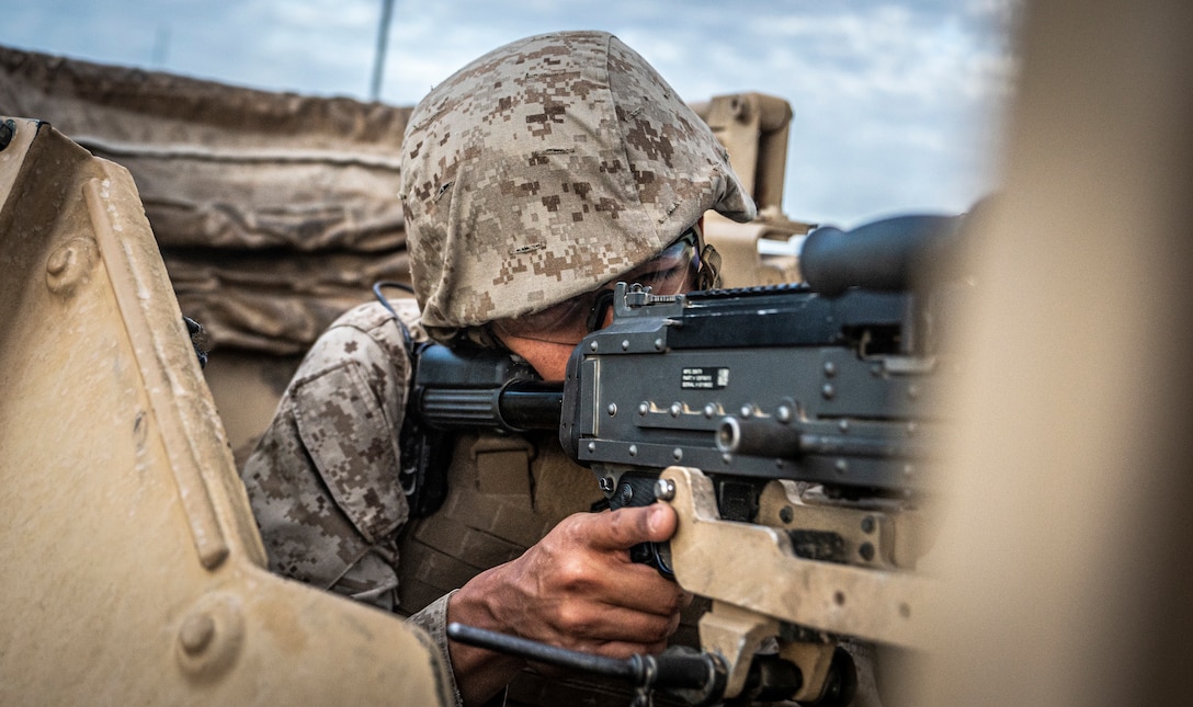 U.S. Marine Corps Cpl. Alex Maciel, a motor transport operator with Marine Wing Support Squadron 473, 4th Marine Aircraft Wing, Marine Forces Reserve, sets security with a M240 medium machine gun on Range 205 during Integrated Training Exercise 4-22 at Marine Corps Air-Ground Combat Center, Twentynine Palms, Calif., July 29, 2022. The mobile operations course challenges supporting elements of the Marine Air-Ground Task Force to respond to contact while delivering logistical supplies to other elements of the MAGTF. ITX is designed to provide large forces the opportunity to command and control their Marines through a live-fire program incorporating every element of the MAGTF. (U.S. Marine Corps photo by Sgt. Matthew Teutsch)