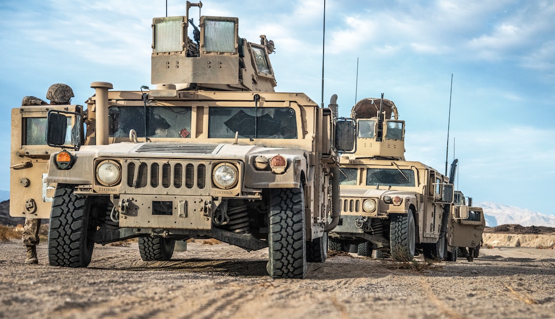 Multiple Humvee's are staged before being utilized by Marines from Marine Wing Support Squadron 473, 4th Marine Aircraft Wing, Marine Forces Reserve, to preform a mobile operations course on range 205A at Marine Corps Air Ground Combat Center (MCAGCC), Twentynine Palms, Calif., July 29, 2022. The mobile operations course challenges supporting elements of the Marine Air-Ground Task Force to respond to contact while delivering logistical supplies to other elements of the MAGTF. ITX is designed to provide large forces the opportunity to command and control their Marines through a live-fire program incorporating every element of the MAGTF. (U.S. Marine Corps photo by Sgt. Matthew Teutsch)