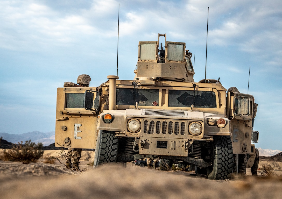 Marines with Marine Wing Support Squadron 473, 4th Marine Aircraft Wing, Marine Forces Reserve, prepare for the mobile operations course on Range 205 during Integrated Training Exercise 4-22 at Marine Corps Air-Ground Combat Center, Twentynine Palms, Calif., July 29, 2022. The mobile operations course challenges supporting elements of the Marine Air-Ground Task Force to respond to contact while delivering logistical supplies to other elements of the MAGTF. ITX is designed to provide large forces the opportunity to command and control their Marines through a live-fire program incorporating every element of the MAGTF. (U.S. Marine Corps photo by Sgt. Matthew Teutsch)
