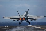 An EA-18G Growler, assigned to the "Wizards" of Electronic Attack Squadron (VAQ) 133, launches from the flight deck of the Nimitz-class aircraft carrier USS Abraham Lincoln (CVN 72).