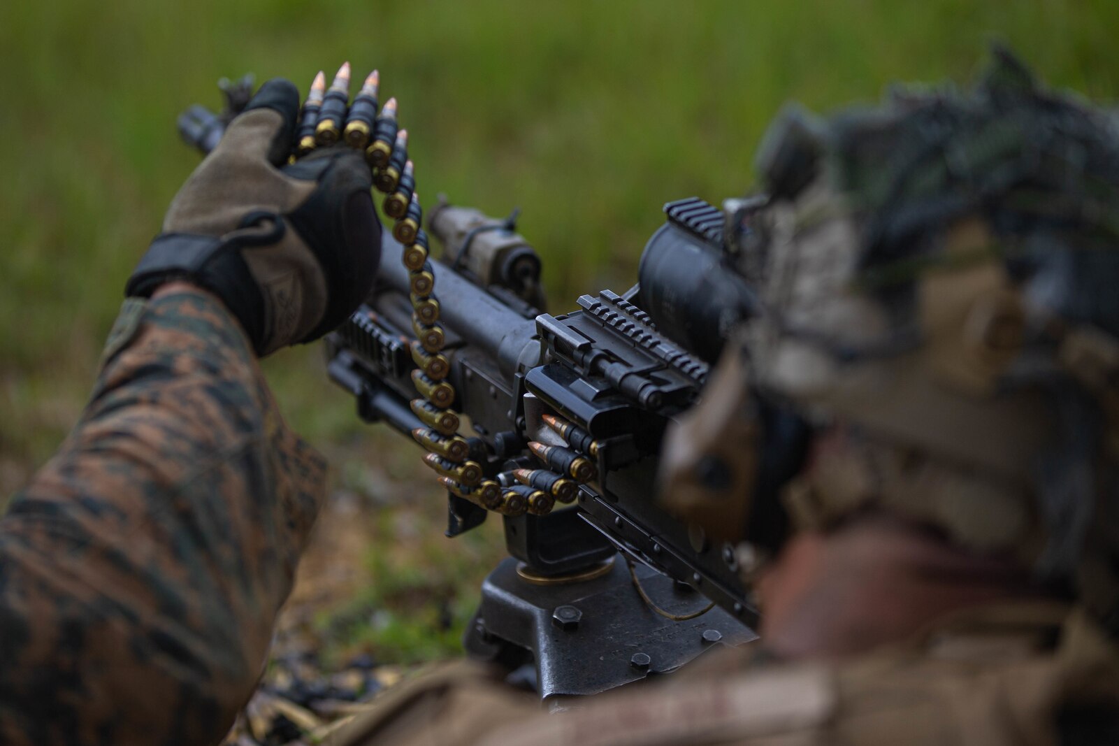U.S. Marine Corps Lance Cpl. Hyatt Duncan, a machine gunner with 3d Battalion, 2d Marines, fires an M240B medium machine gun while conducting squad attack drills during a Tactical Small Unit Leader Course on Camp Schwab, Okinawa, Japan, July 27, 2022. This training improved the Marines’ proficiency at the tactical level and developed small-unit leadership. 3/2 is forward deployed in the Indo-Pacific under 4th Marines, 3d Marine Division as part of the Unit Deployment Program. Duncan is a native of Atlanta, Georgia. (U.S. Marine Corps photo by Cpl. Diana Jimenez)