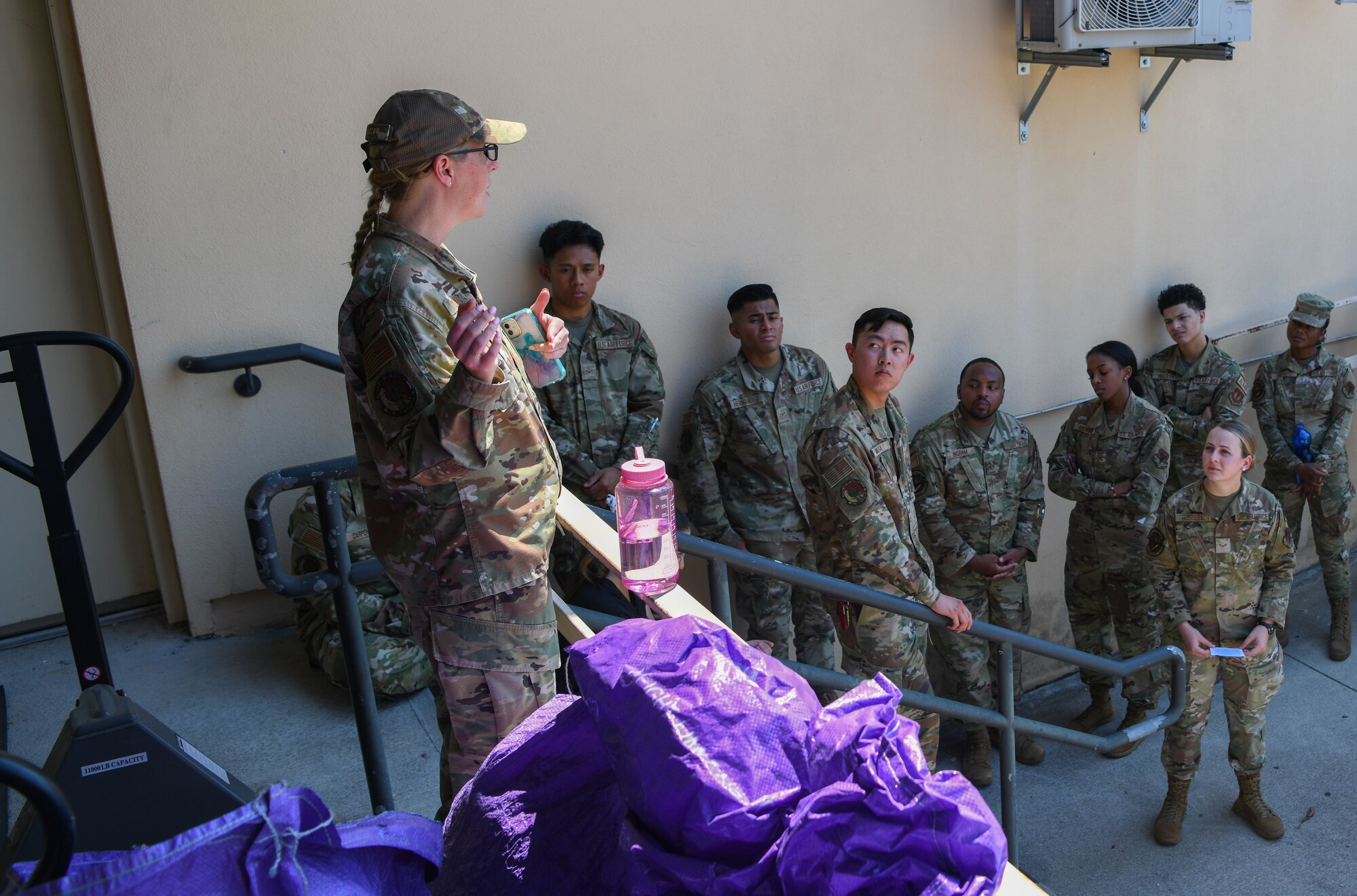 U.S. Air Force Airmen from the 31st Force Support Squadron are briefed on the simulated suspicious package at the post office during an exercise at Aviano Air Base, Italy, July 21, 2022.  The training focused on what indicators to look for on packages and how to minimize danger during a response. Safety is the priority, both for the Airmen involved as well as the base, and this exercise helped emergency responders prepare for a real-world situation. (U.S. Air Force photo by Airman 1st Class Thomas Calopedis)