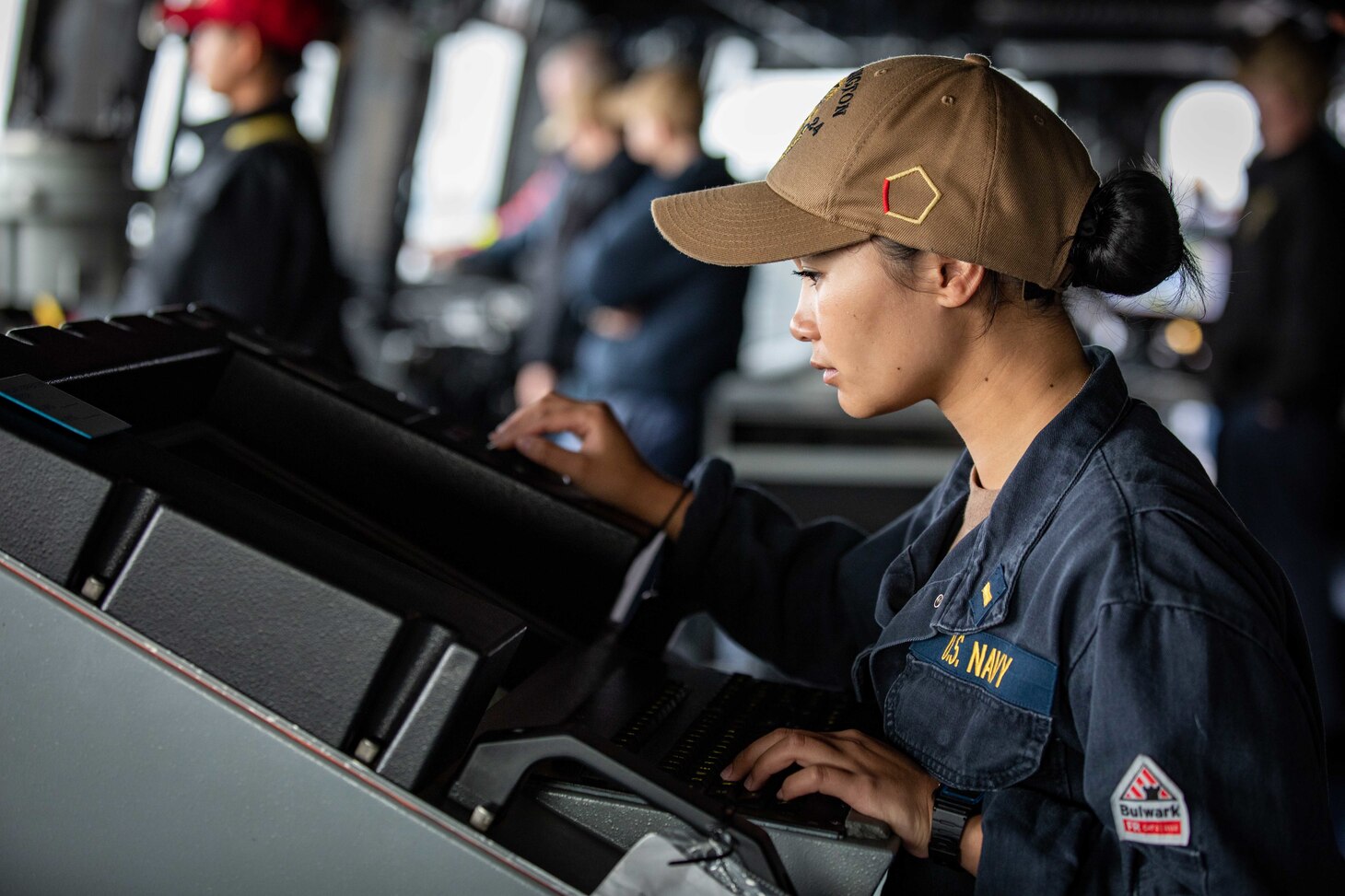 U.S. Navy Ensign Glennalyn Ajero, assigned to the San Antonio-class amphibious transport dock ship USS Arlington (LPD 24), stands watch in the pilot house as Arlington transits the Danish Straits to enter the Baltic Sea, Aug. 2, 2022.