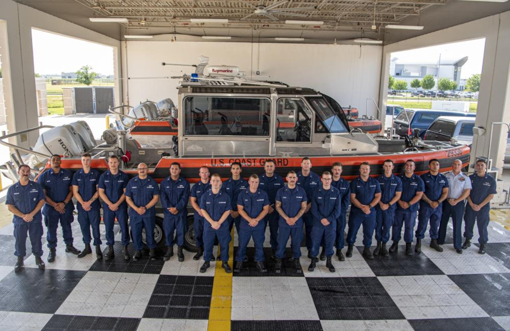 Members from Coast Guard Maritime Safety & Security Team Houston pose for a photo in the unit’s boat shed in Houston, Texas, July 14, 2022. The members gathered for an all-hands meeting following their recent deployment conducting search and rescue missions on the Rio Grande. (U.S. Coast Guard photo by Petty Officer 1st Class Corinne Zilnicki)