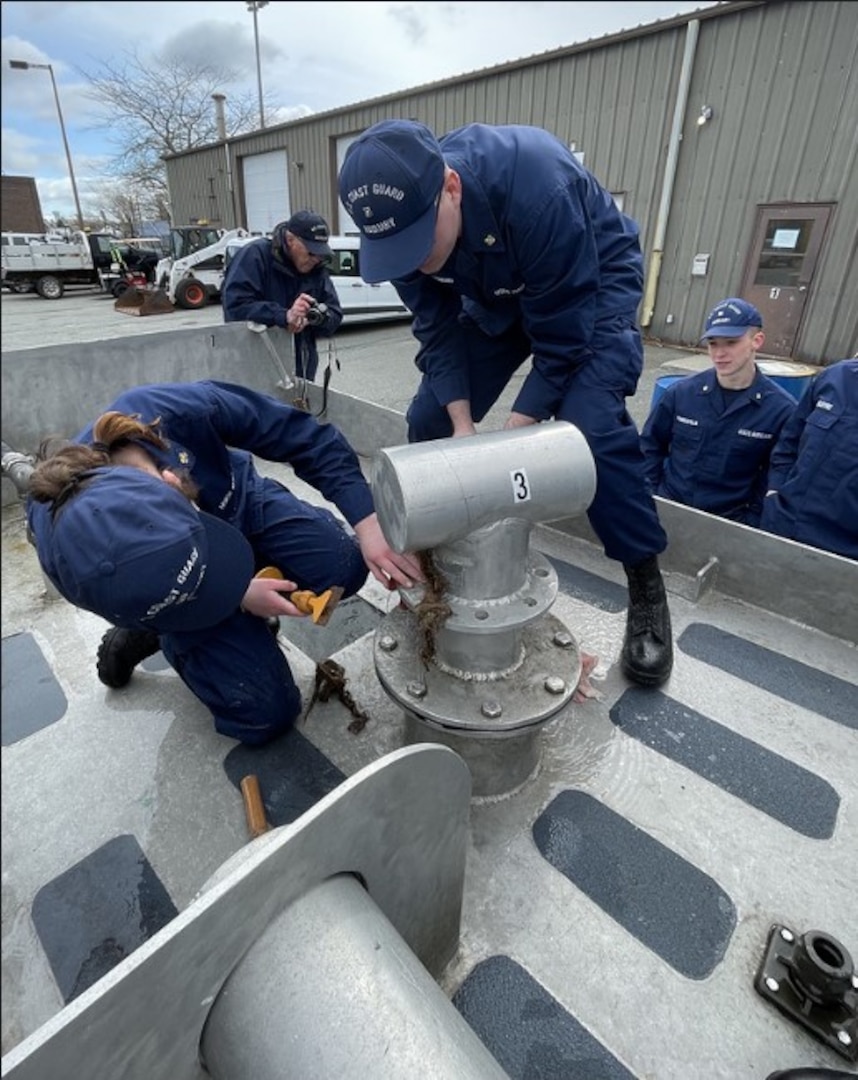 CHATHAM, MA – Massachusetts Maritime Academy Auxiliary University Program (AUP) cadets practice various damage control techniques during S-Train with other Auxiliary and active duty units while other auxiliarists  observe. U.S. Coast Guard Auxiliary Photo by Auxiliarist Lisa Goodwin.