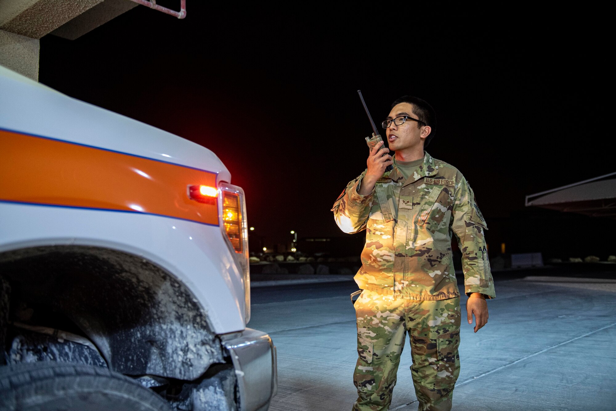 U.S. Air Force Senior Airman Raphael Silva, 379th Expeditionary Medical Group, tests a radio July 25, 2022 at Al Udeid Airbase, Qatar. Medics must maintain emergency response readiness at all times. (U.S. Air National Guard photo by Master. Sgt. Michael J. Kelly)